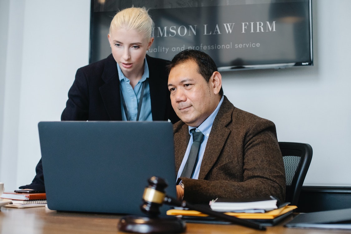 Associate consulting with a lawyer 2 - Reputable Law Firms