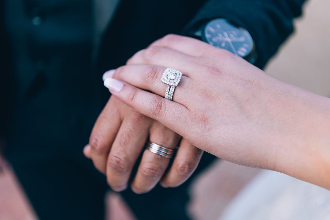 bride wearing square diamond ring - Unconventional Wedding Rings You Should Consider